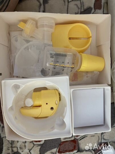 Молокоотсос medela электрический