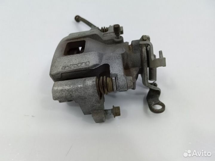 Суппорт тормозной задний левый Outlander 2012-2021