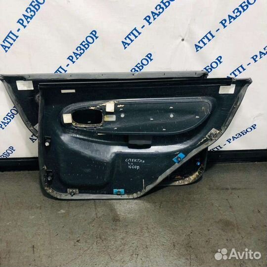 Обшивка двери зад лев Kia Spectra