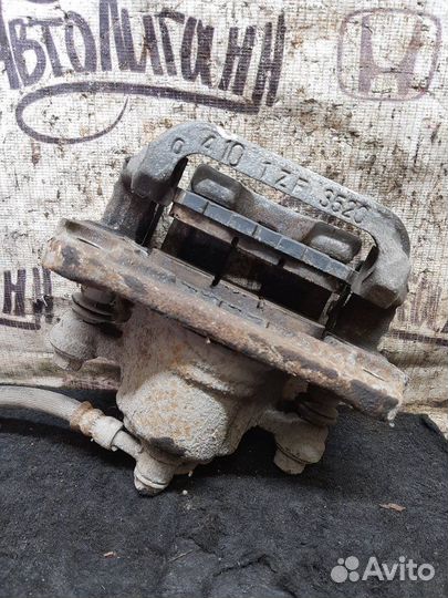 Суппорт задний левый Nissan X-Trail MR20 2012