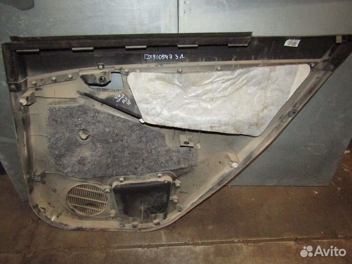 Обшивка двери задней левой MK Cross 2011