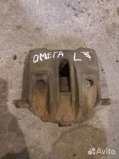 Суппорт тормозной передний левый Опель Омега Б
