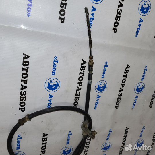 Трос стояночного тормоза левый Hyundai Accent 3