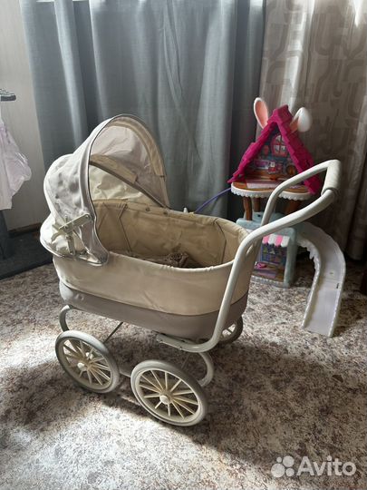 Игрушечная коляска для кукол