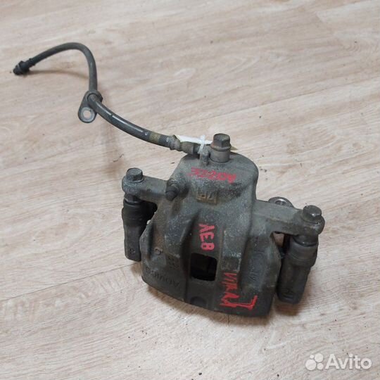 Суппорт тормозной передний левый Suzuki Grand