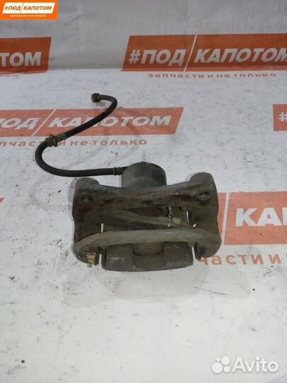 Суппорт тормозной передний левый Nissan Teana J32