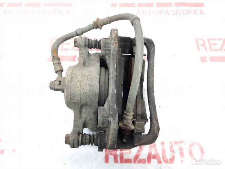 Суппорт тормозной передний правый Nissan Cube Z10