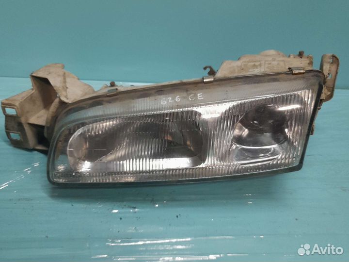 Левая фара mazda 626 ge