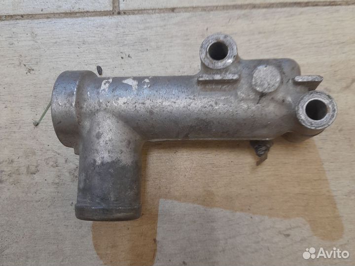 Патрубок помпы Паджеро 2