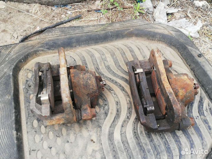 Суппорт тормозной передний Киа Рио 1