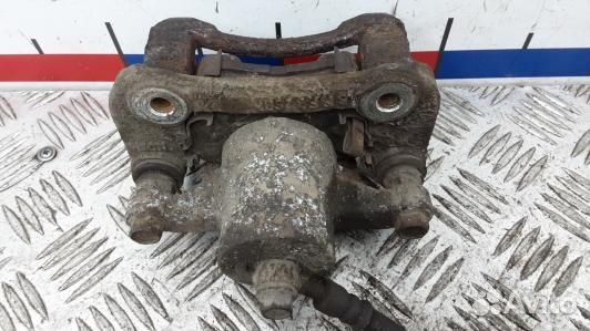 Суппорт тормозной задний левый KIA sportage 3 (ZML