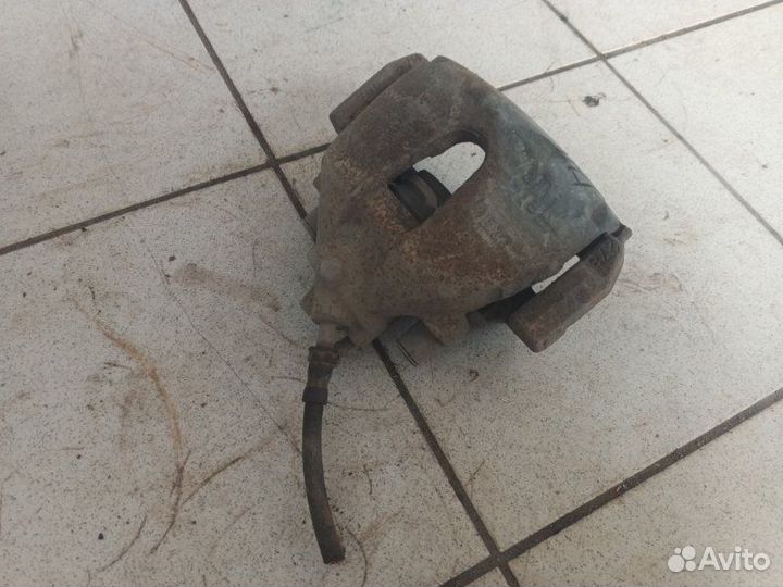 Суппорт тормозной передний правый Ford Focus shda