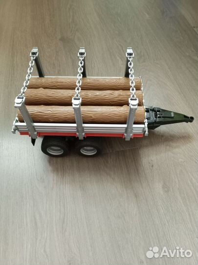 Bruder прицеп с бревнами