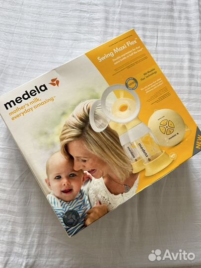 Молокоотсос medela swing maxi