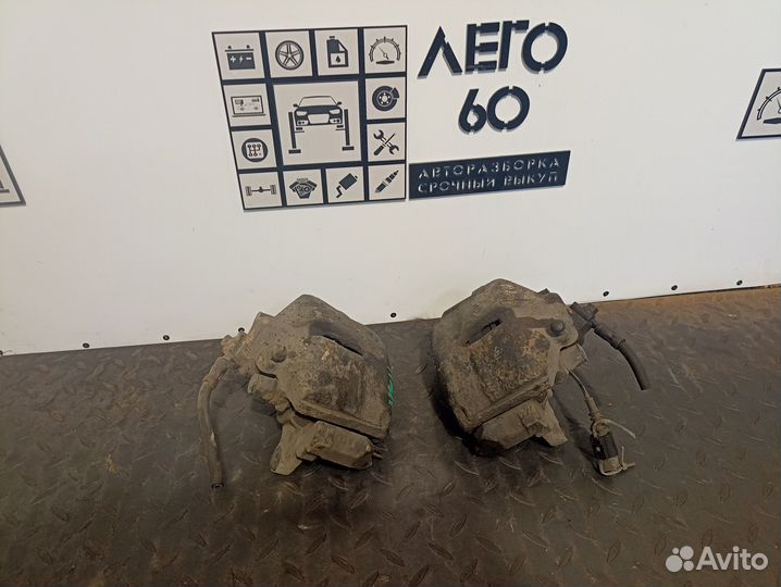 Суппорт тормозной передний VW Passat B6