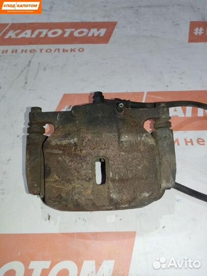 Суппорт тормозной передний левый Nissan X-Trail