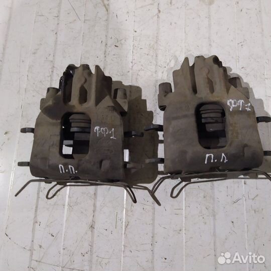 Суппорт тормозной передний Ford Focus 1 седан 1.6