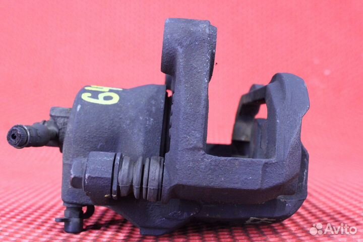 Суппорт тормозной передний левый Nissan Teana J31