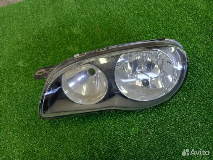 Фара левая Toyota Sprinter Carib AE115