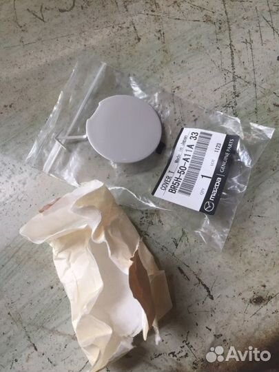 Заглушка буксировочного крюка передняя Mazda 3 BK