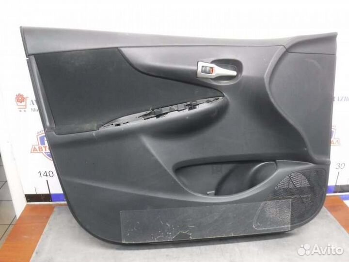 Обшивка двери передняя левая Toyota Corolla 151