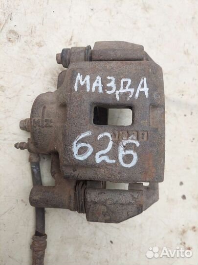 Суппорт передний правый на mazda 626