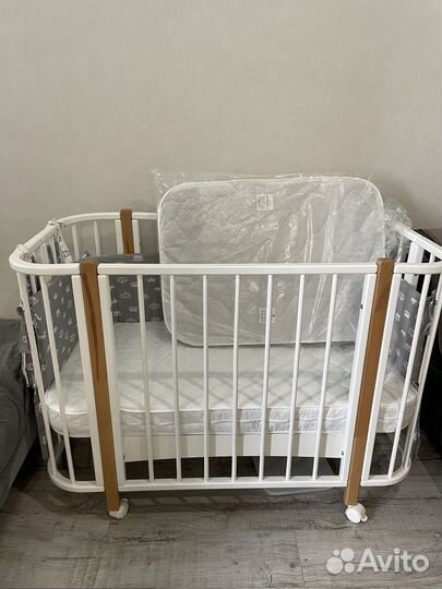 Детская кроватка с продольным маятником