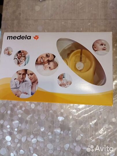 Молокоотсос medela электрический