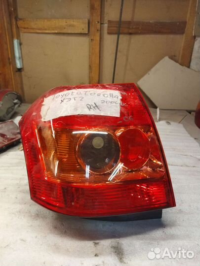 Фонарь левый Corolla 120 хетч Koito 13-87