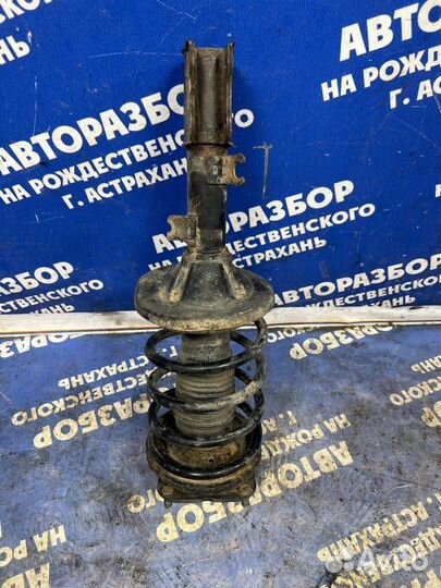 Передняя левая стойка амортизатора Kia Shuma 2