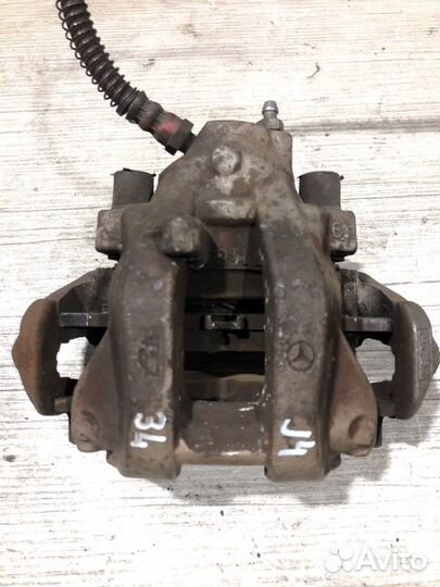 Суппорт тормозной задний левый Mercedes-Benz