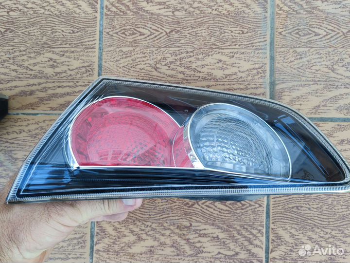 Фонарь крышки багажника lancer 10