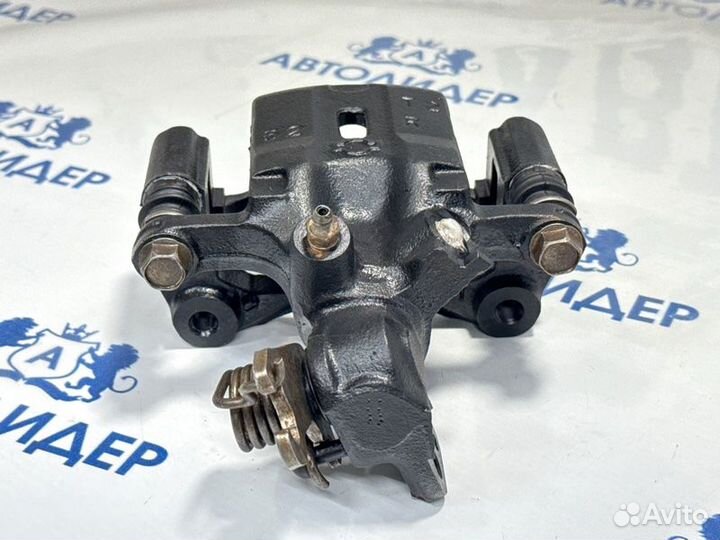 Суппорт задний правый Nissan Primera P12 QG18DE