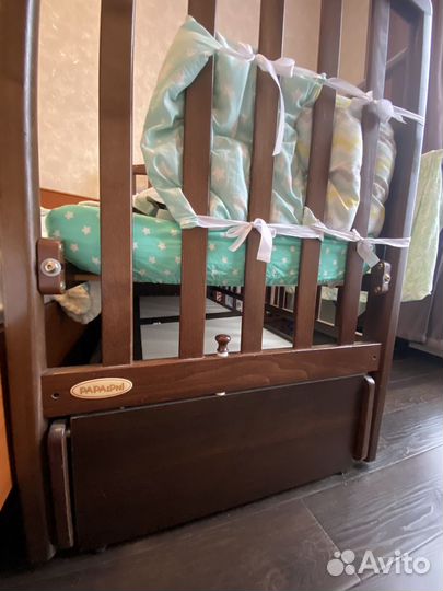Детская кроватка с продольным маятником