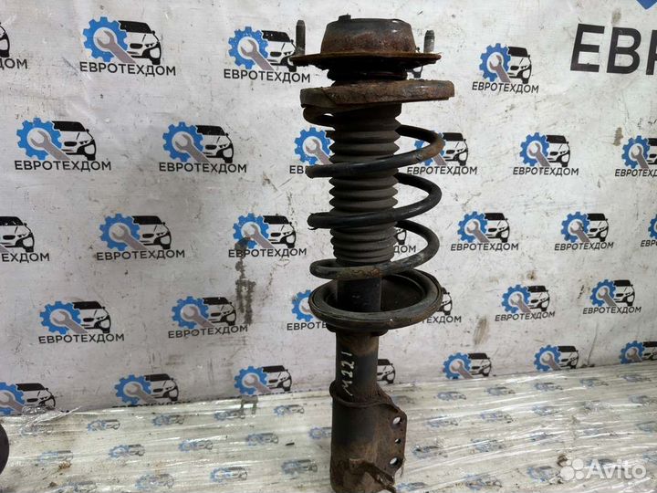 Амортизатор передний левый Mazda 323 Fba hatchback