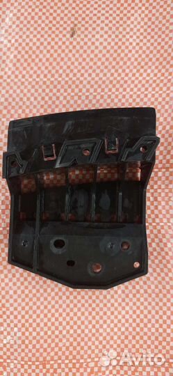 Кронштейн переднего бампера левый Nissan X-Trail 2