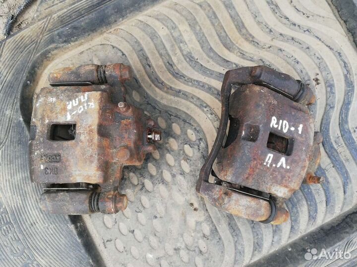 Суппорт тормозной передний Киа Рио 1