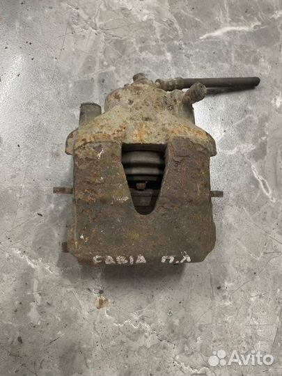 Суппорт тормозной передний левый Skoda Fabia