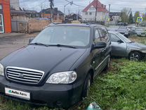 Kia Carnival 2.5 AT, 2004, битый, 180 000 км, с пробегом, цена 260 000 руб.