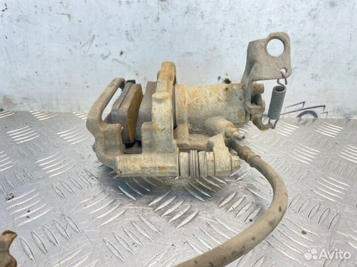 Суппорт тормозной задний левый Chevrolet Cruze