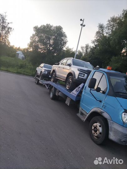 Эвакуатор с прицепом для двух автомобилей