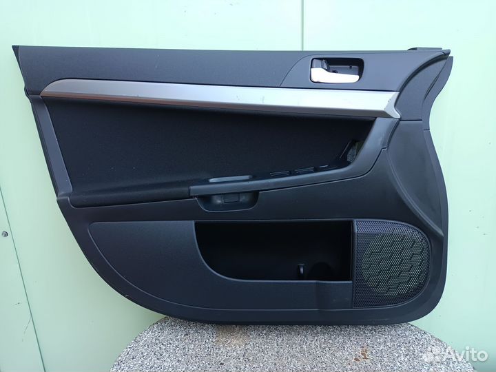 Обшивка двери передней левой Митцубиси Лансер 10