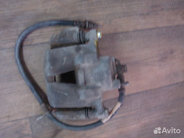 Суппорт тормозной правый Toyota 47730-52010