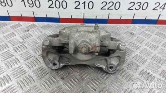 Суппорт тормозной передний левый mitsubishi L200 K