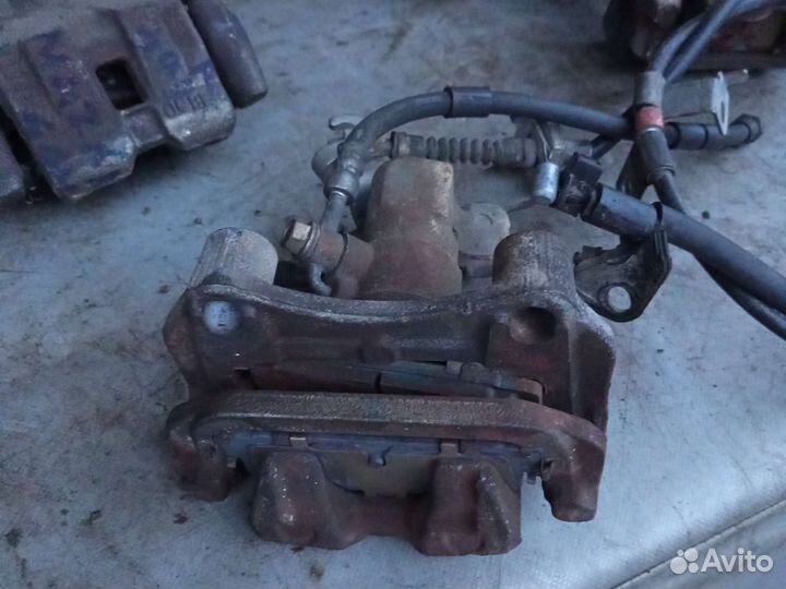 Суппорт задний левый и правый Mazda 6 GH