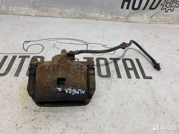 Суппорт передний правый Nissan Almera Classic B10