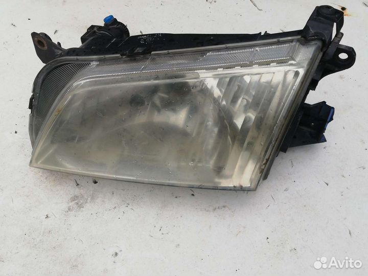 Фара Мазда Демио 1