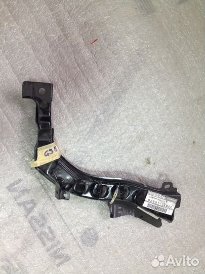 Суппорт кронштейн фары левый Infiniti G35 Q40