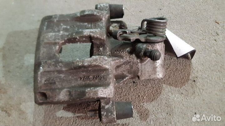 Суппорт тормозной задний левый задний левый Ford