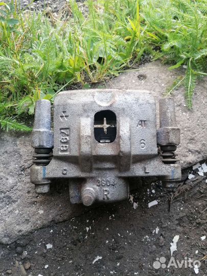 Суппорт mitsubishi лансер задний